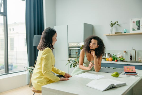 A lady consulting to a doctor.